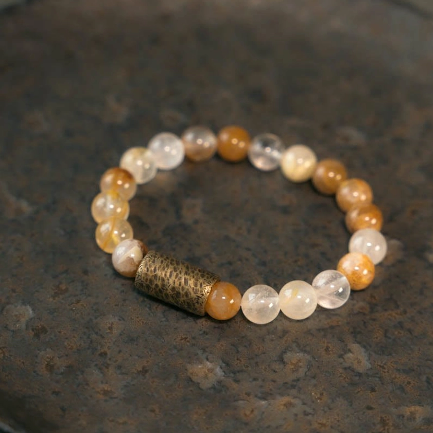 Gold rutilated quartz bracelet variant showing golden inclusions and premium elastic cord