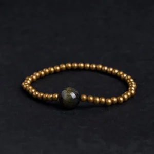 Gold Sheen Obsidian Copper Brass Buddhist bracelet top view flat lay with large obsidian center stone