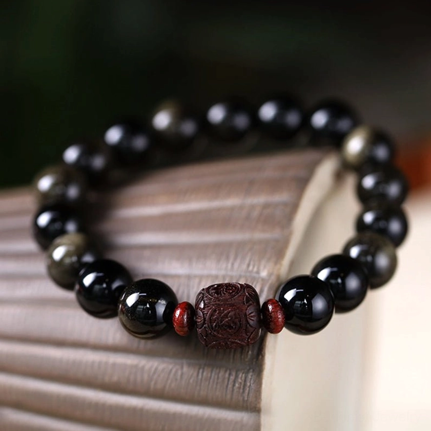 Gold Sheen Obsidian Fu character bracelet showing polished black obsidian with metallic golden flecks and carved auspicious symbol
