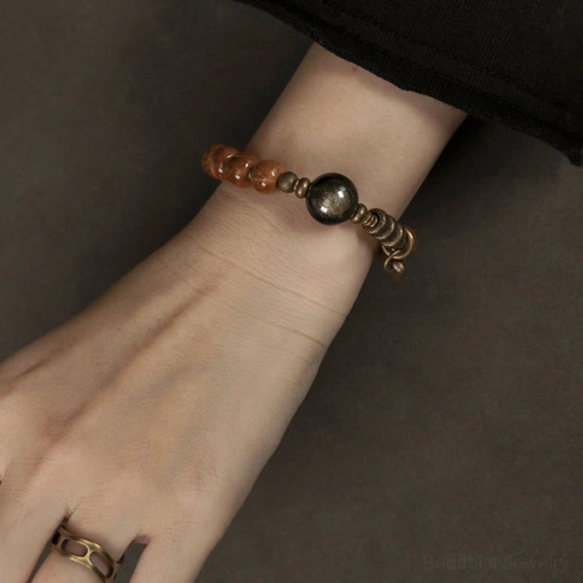 Gold sheen obsidian bracelet prosperity abundance spiritual significance
