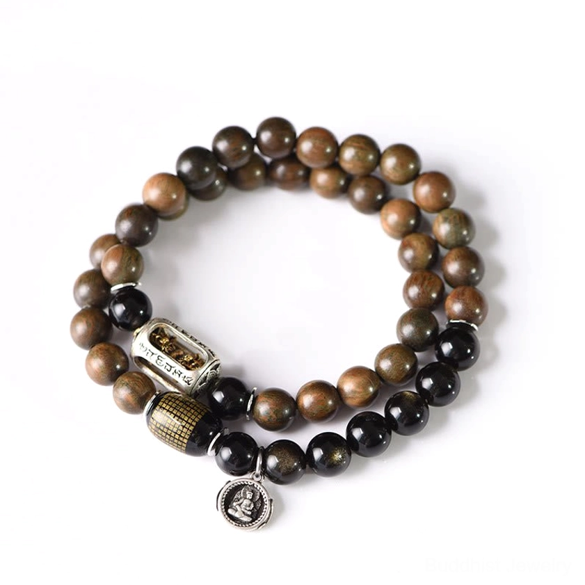 Gold sheen obsidian and sandalwood beads under lighting revealing glossy protective stone properties