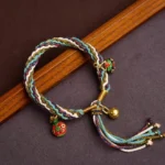 Gold Swallowing Beast family bracelet handmade Buddhist protection knot braid with three enamel charms and gold bell