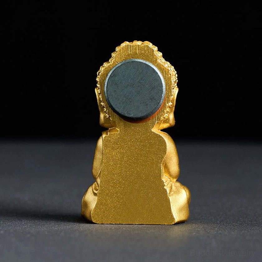 Golden Buddha fridge magnet rear view showing circular magnet backing and resin construction