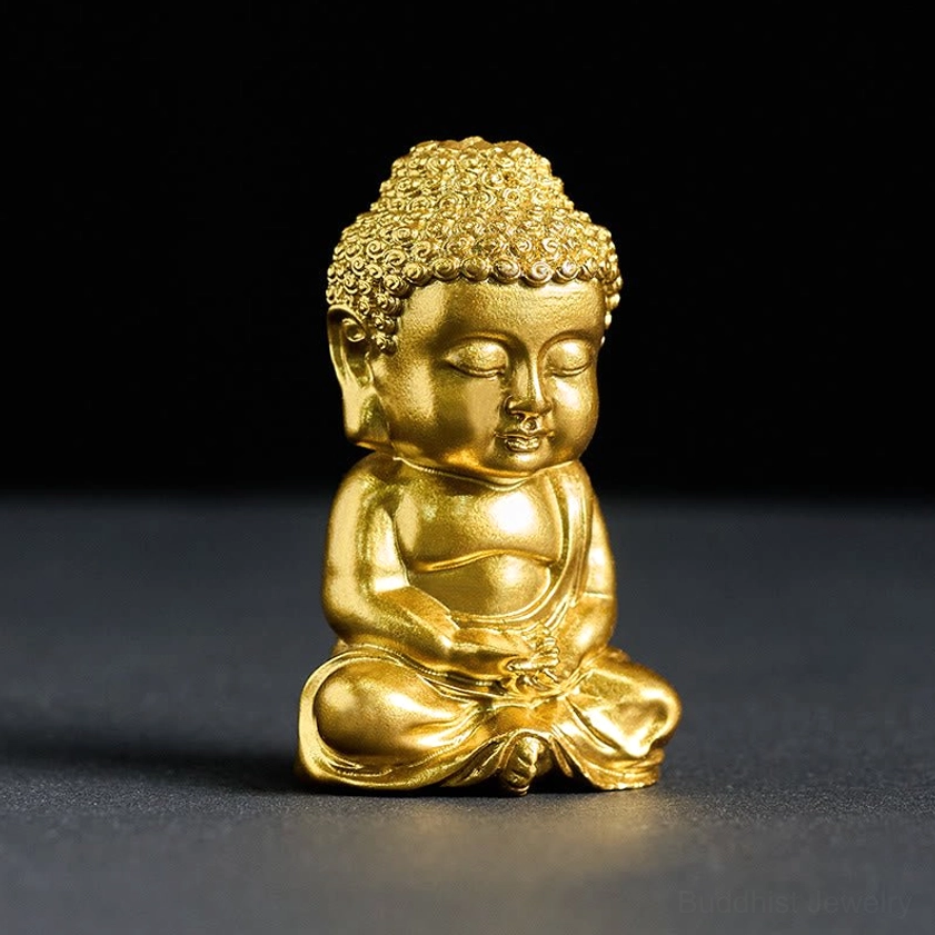 Golden Buddha statue right three-quarter angle showing detailed curly hair and cross-legged meditation pose