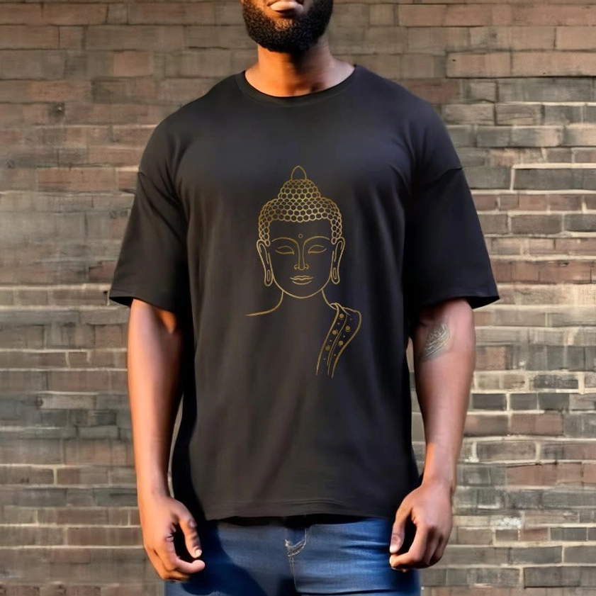 Golden Buddha spiritual t-shirt outdoor lifestyle - male model wearing black tee with gold Buddha print against brick wall background