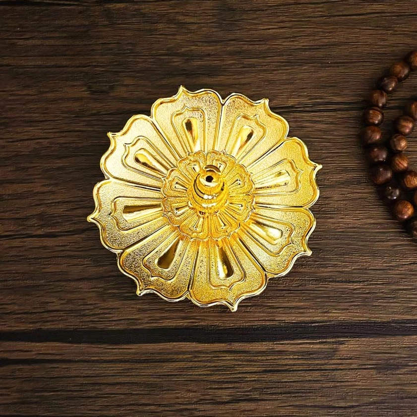 Golden lotus incense holder with hollow petal design and central incense socket for Buddhist practice