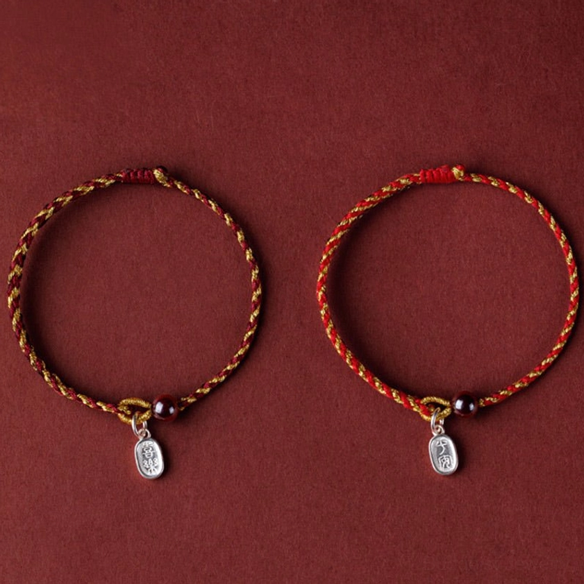 Golden lotus pod charm on red gold braided string - handcrafted Buddhist jewelry