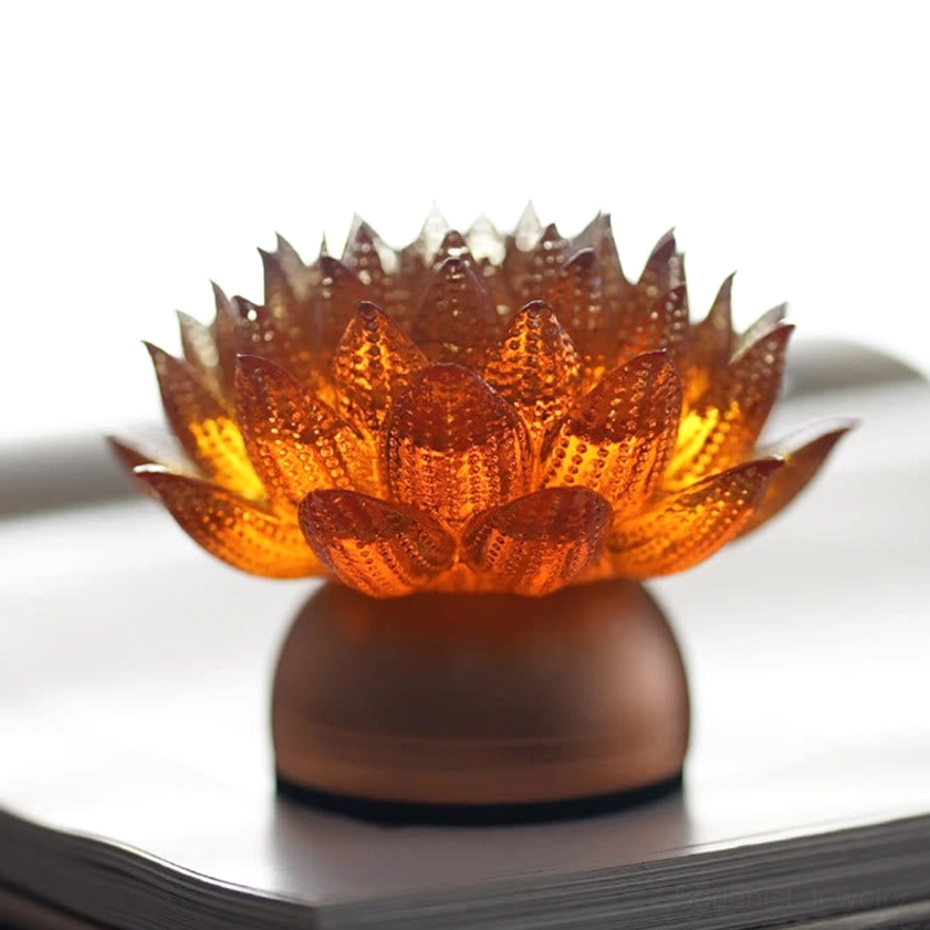 Golden lotus sculpture multiple angles, showing petal layering and lighting effects