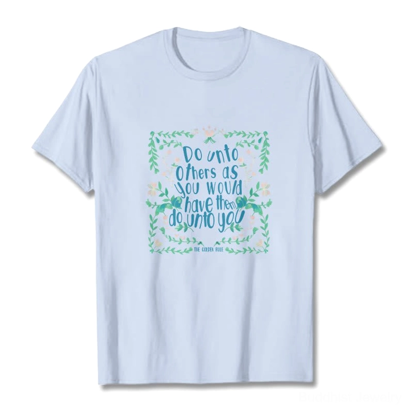 Light cyan Buddhist tee with green leaf golden rule print laid flat showing vibrant spiritual graphic design