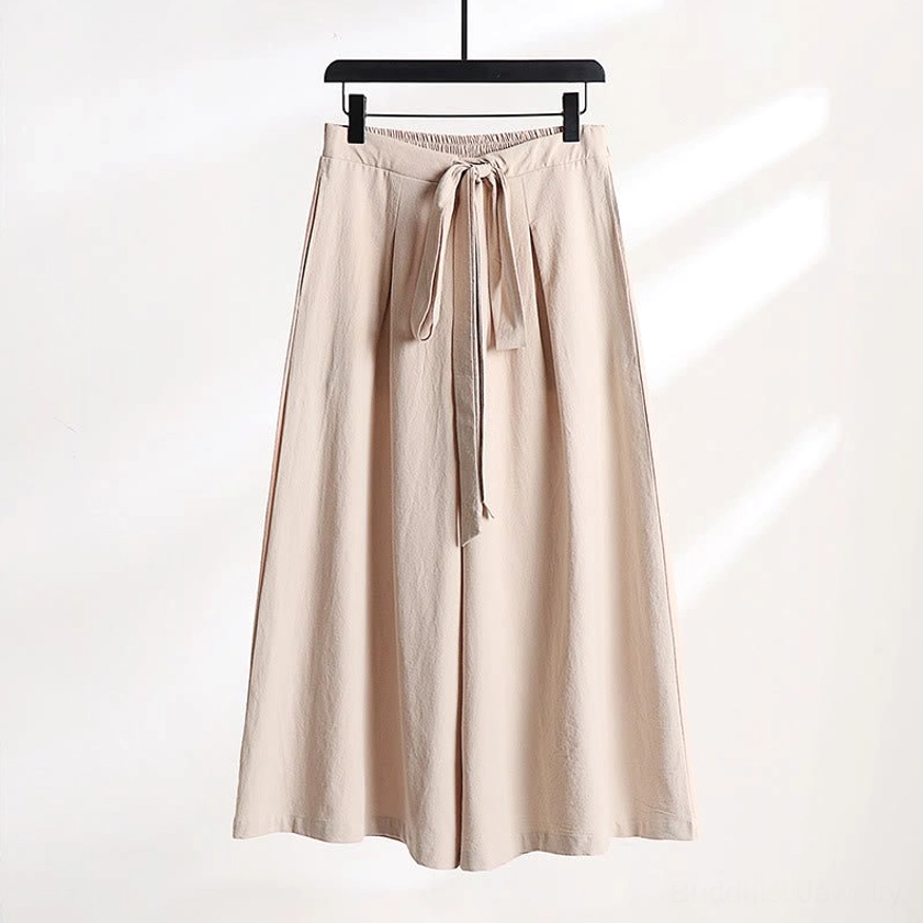 Gray wide-leg meditation pants with tie closure and ankle-length design front
