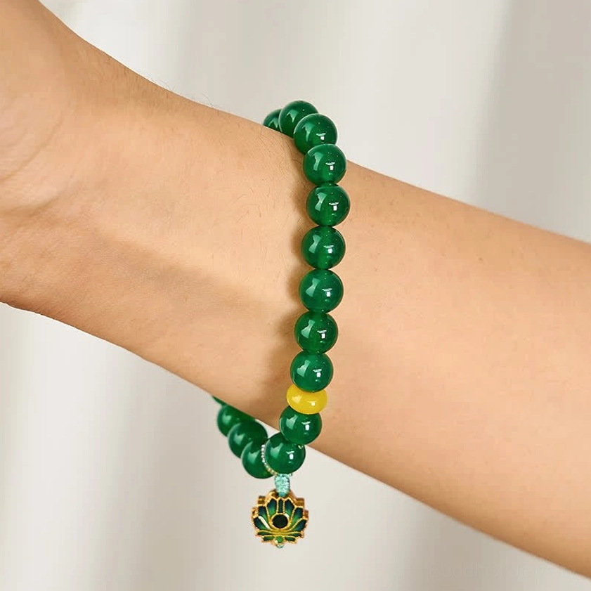 Green agate beaded bracelet worn on forearm displaying the complete design with natural stone beads and enamel lotus pendant