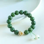 Green Bodhi Seed Buddhist bracelet with carved Om Mani Padme Hum mantra beads and white tassel charm pendants