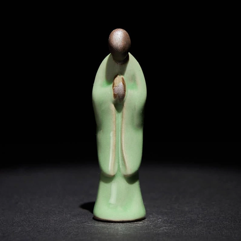 Green bowing monk ceramic statue compact size hand-sculpted spiritual practice