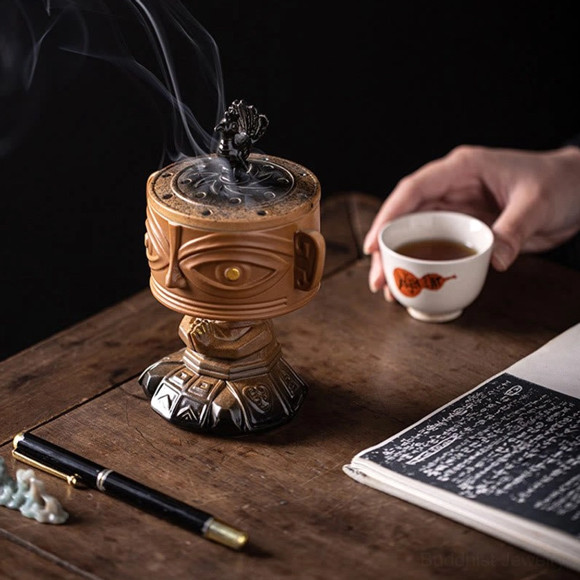 Green ceramic incense burner with carved relief carving, artistic studio photography