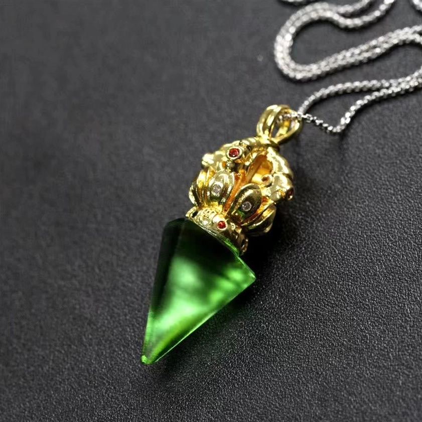 Green Dorje Vajra liuli crystal pendant with gold-toned cap - Buddhist necklace three-quarter view
