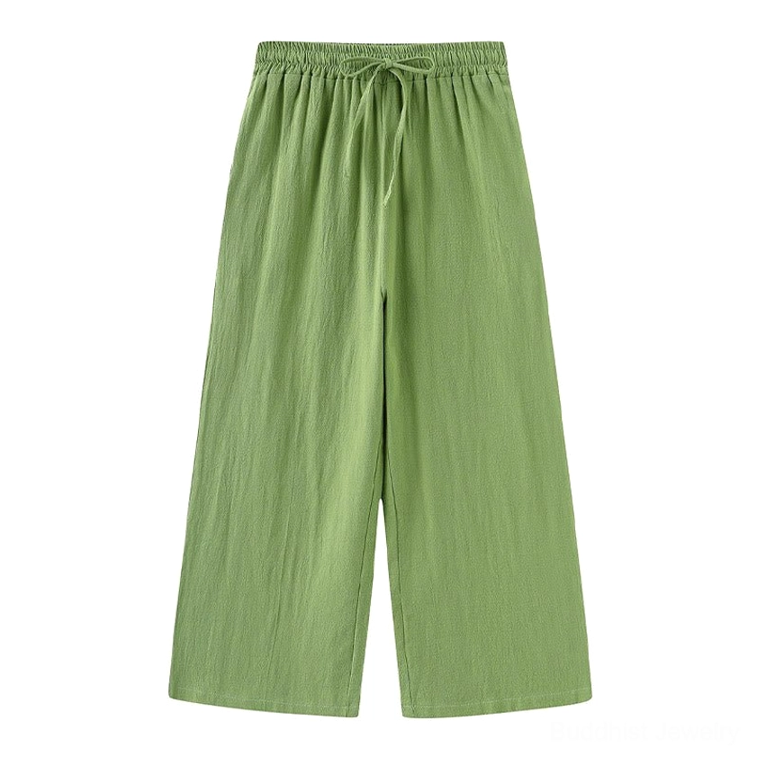 Green cotton drawstring meditation pants with wide-leg fit front view on white background