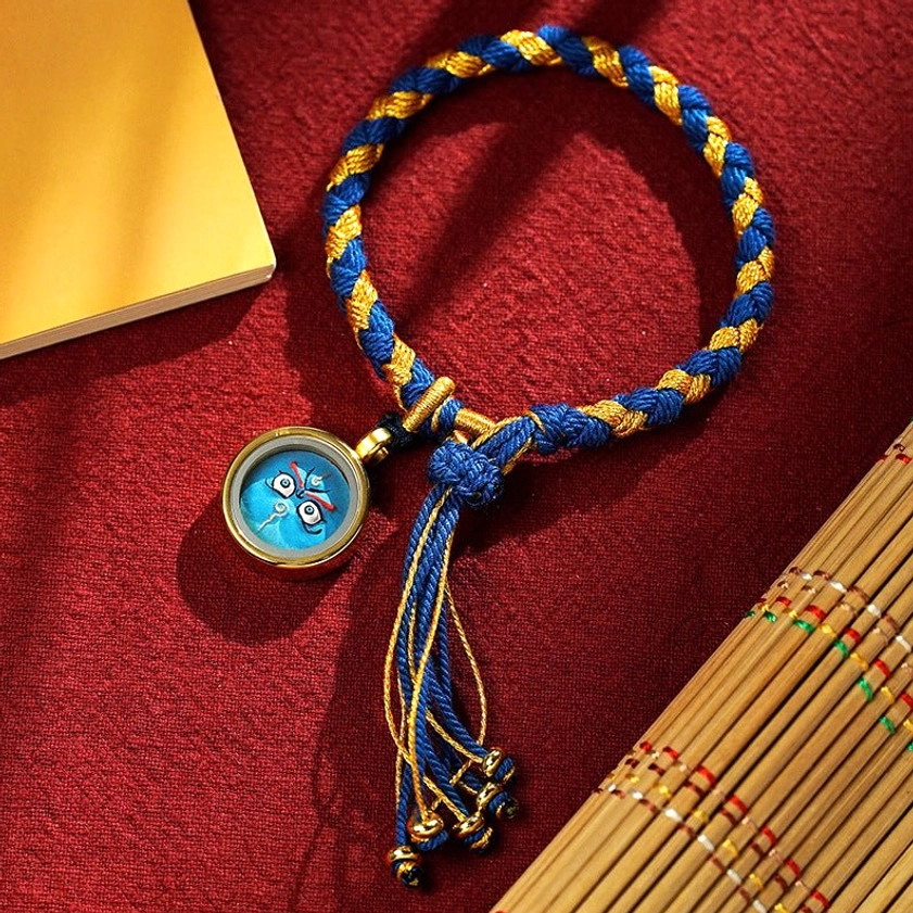 Green God of Wealth braided rope bracelet with green-gold braid and green amulet charm, Buddhist success and harmony prosperity piece