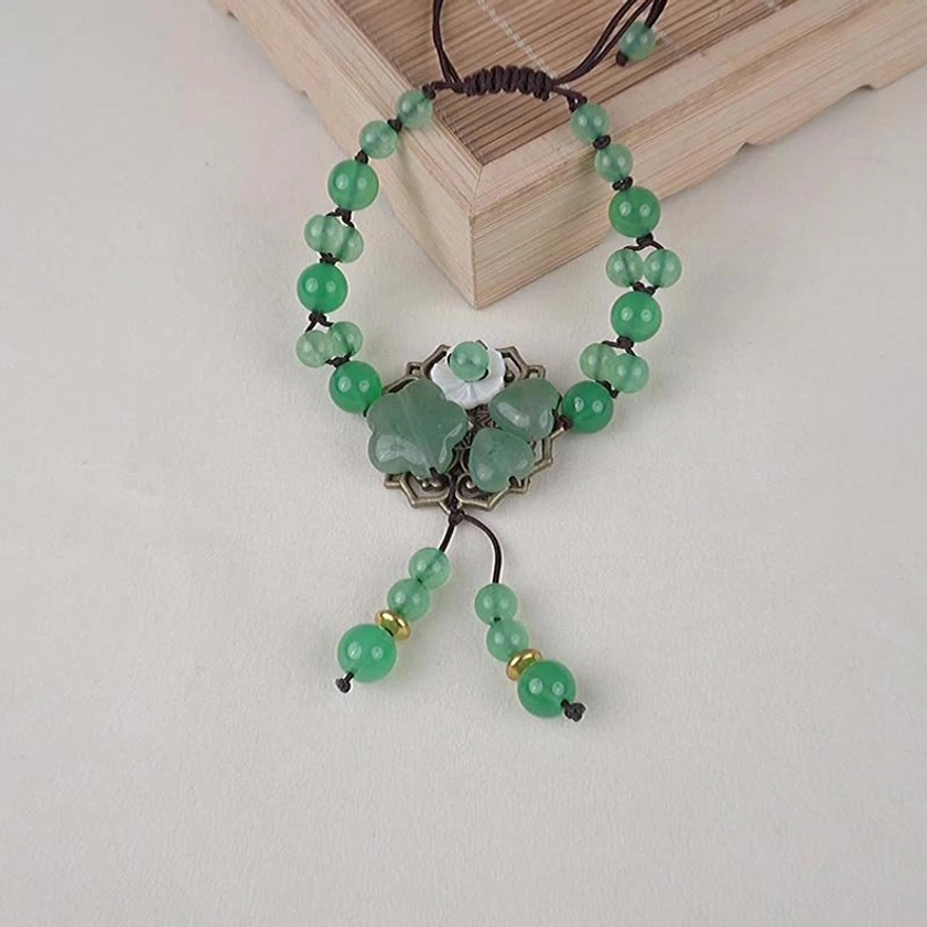 Green jade and aventurine bracelet showing combined metaphysical properties for prosperity and balance