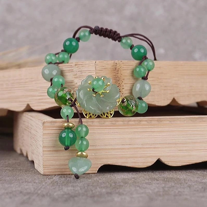 Natural jade flower bracelet demonstrating chakra balancing and meditation benefits, spiritual wellness jewelry
