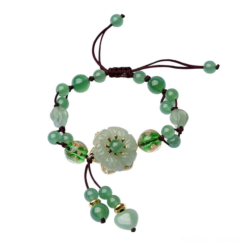 Green jade flower bracelet with braided cord and dangling pendant displayed on white background, minimalist flat view