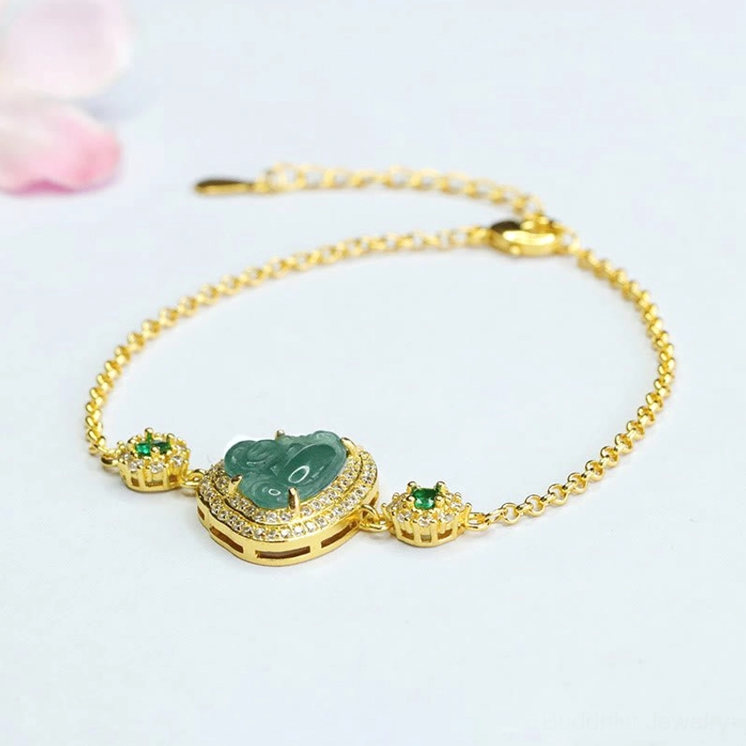 Handcrafted green jade Laughing Buddha bracelet with delicate gold chain and zircon crystal frame on minimalist background