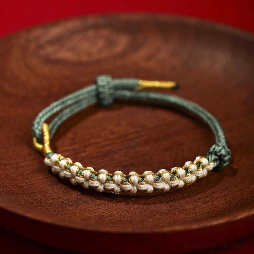 Green handwoven Buddhist peach blossom knot bracelet for growth, balance, and prosperity
