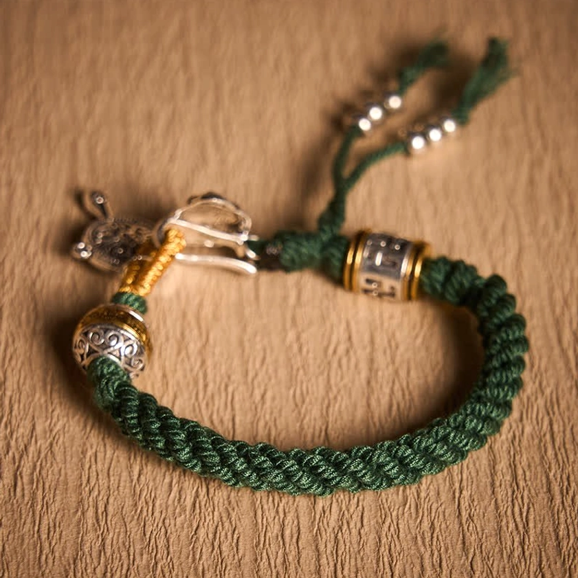 Green Rope Buddhist Bracelet Flatlay Presentation with Details