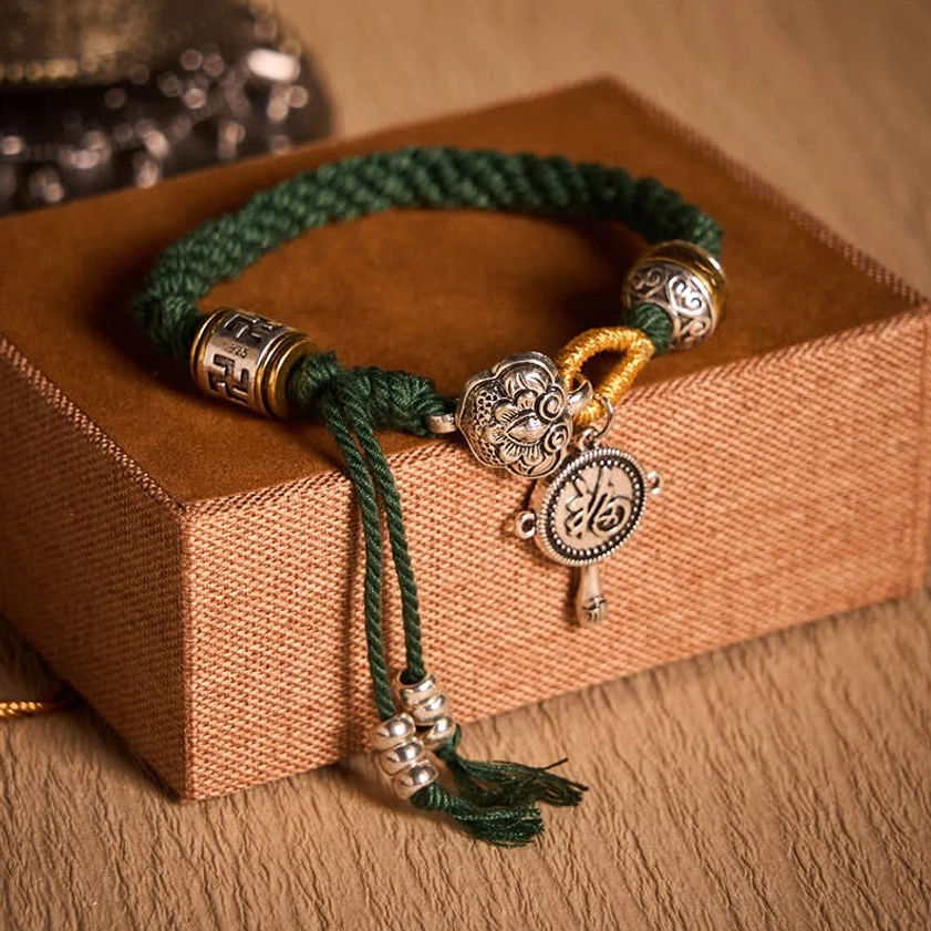 Green Rope Buddhist Braided Bracelet with Sacred Symbols and Silver Accents