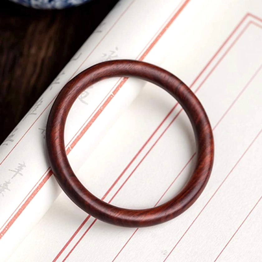 Green Sandalwood Buddhist Protection Bangle - close-up detail of natural wood color and polished surface