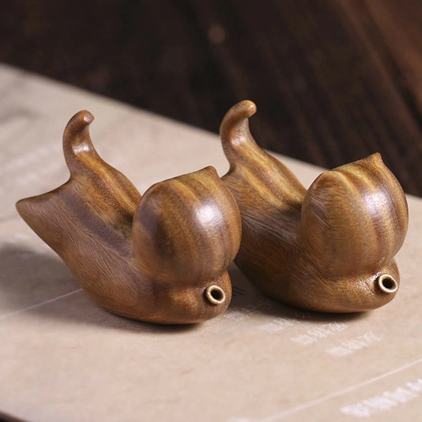 Two matching handcrafted green sandalwood cat incense holders, right side view showing identical wood grain patterns and metal incense ports