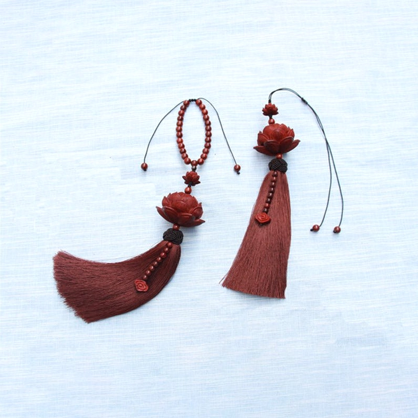 Green sandalwood lotus tassel decoration with natural wood tones and braided knot accent