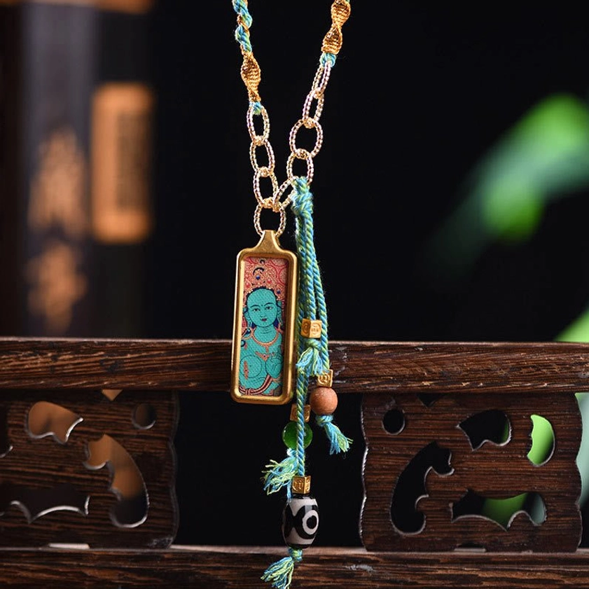 Green Tara Bodhisattva thangka pendant necklace with titanium steel frame and protective energy symbolism