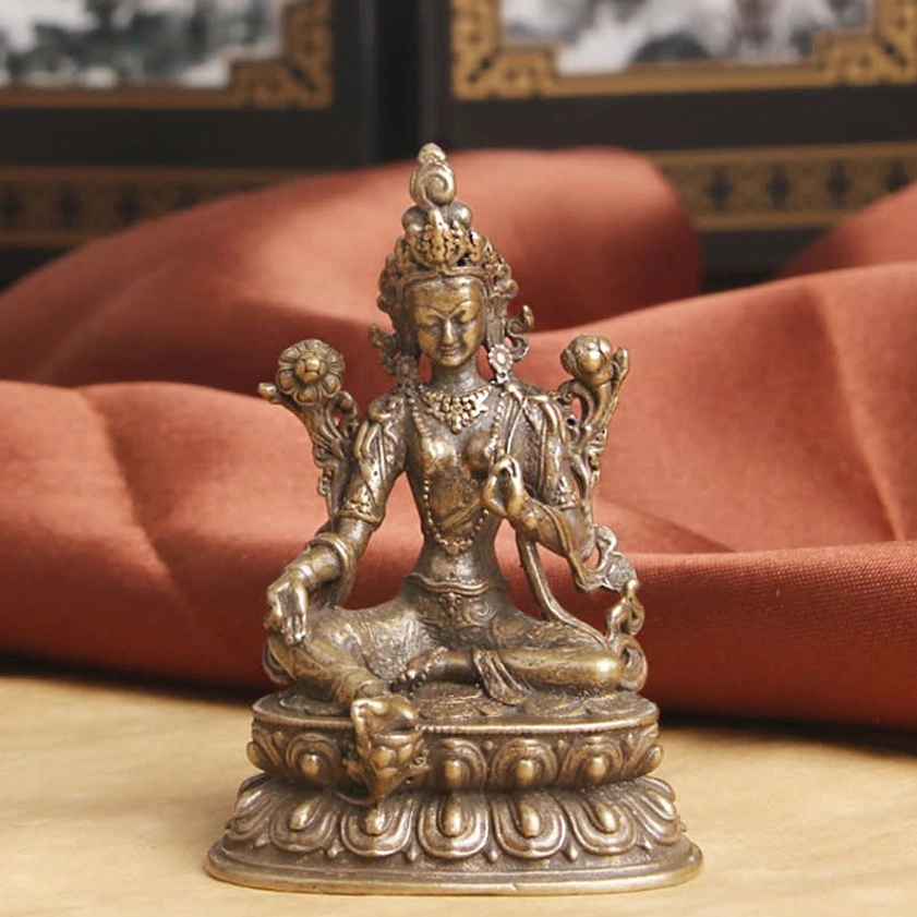 Green Tara Bodhisattva statue frontal view with intricate religious details and vintage bronze tone