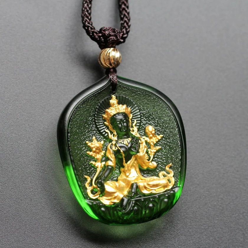 Green Tara Buddha gold-plated liuli crystal pendant necklace front view with golden halo and embossed seated Buddha relief on dark green crystal