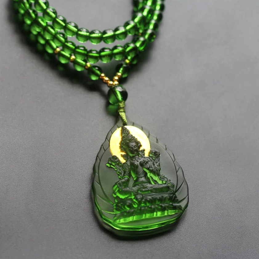 Green Tara Buddha pendant necklace multi-layer beaded chain front view with clear embossed seated Tara Buddha and radiant gold halo