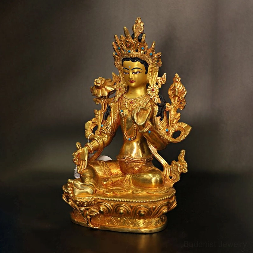 Green Tara bodhisattva statue left side profile showing lotus posture and ornate crown