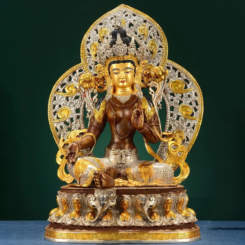 Green Tara Buddhist statue with gilt decorative ornaments and traditional seated meditation pose on engraved lotus base