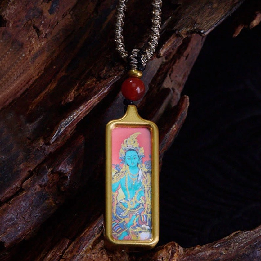 Green Tara Buddhist thangka pendant necklace featuring the compassionate Green Buddha deity, gold frame, red agate bead and twisted cord