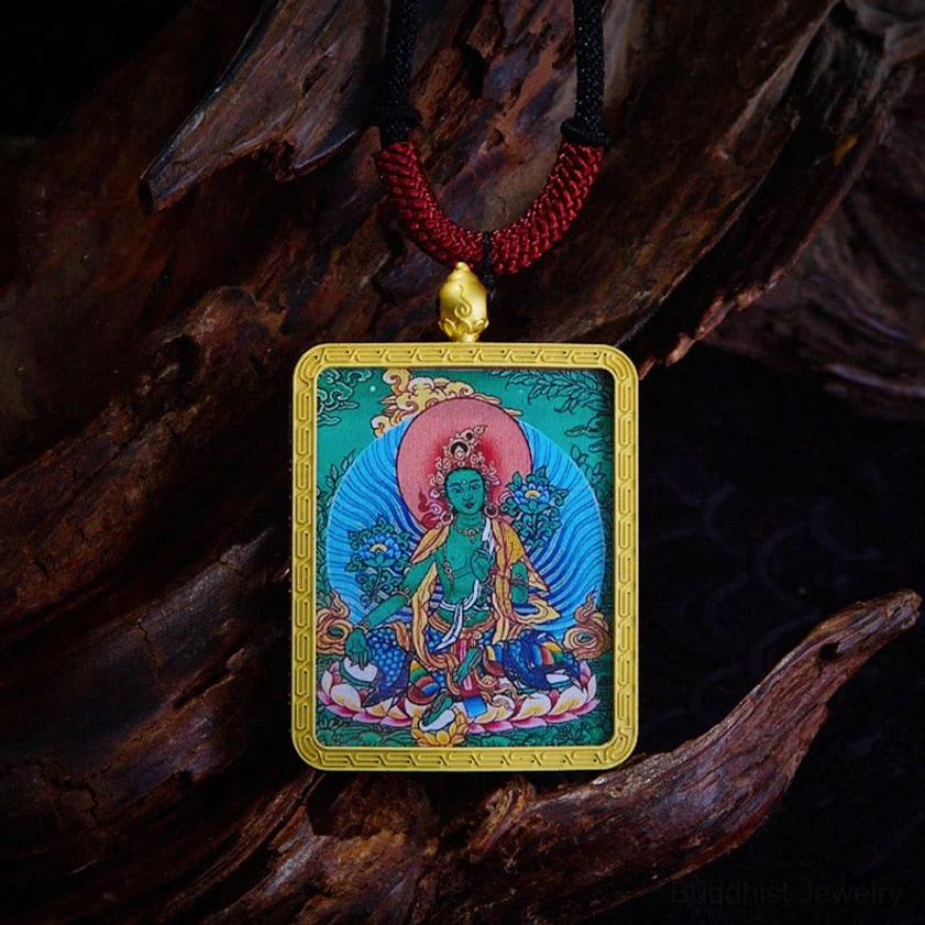 Green Tara Buddhist Thangka pendant representing compassion and spiritual protection with emerald symbolism
