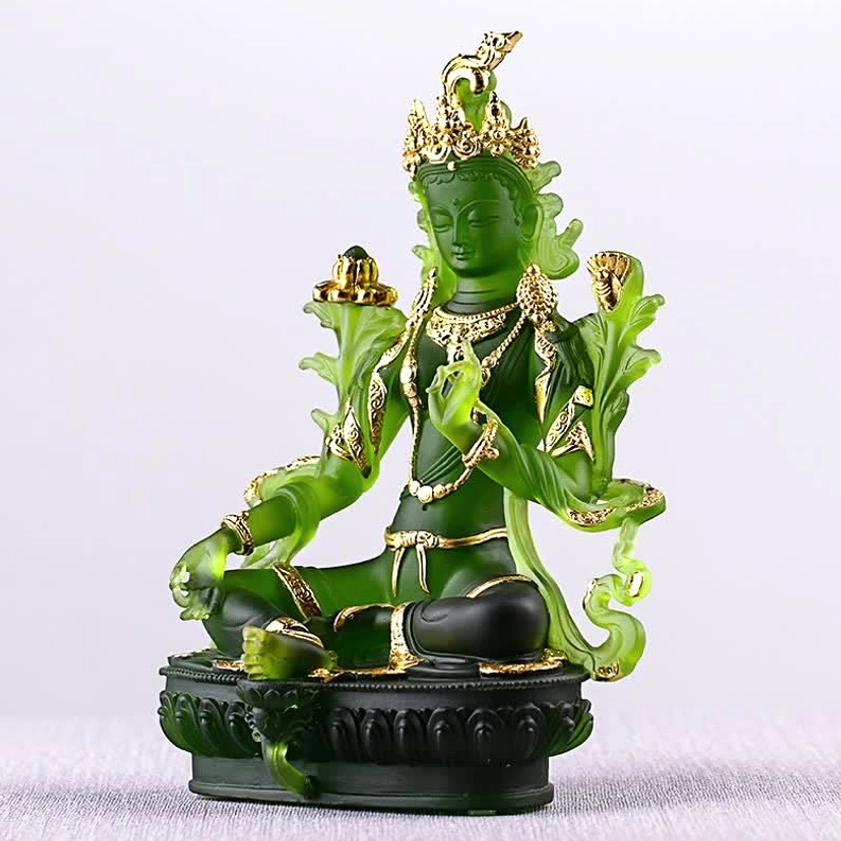 Green Tara Liuli crystal statue lighting detail showing translucent emerald glow and light-refraction properties