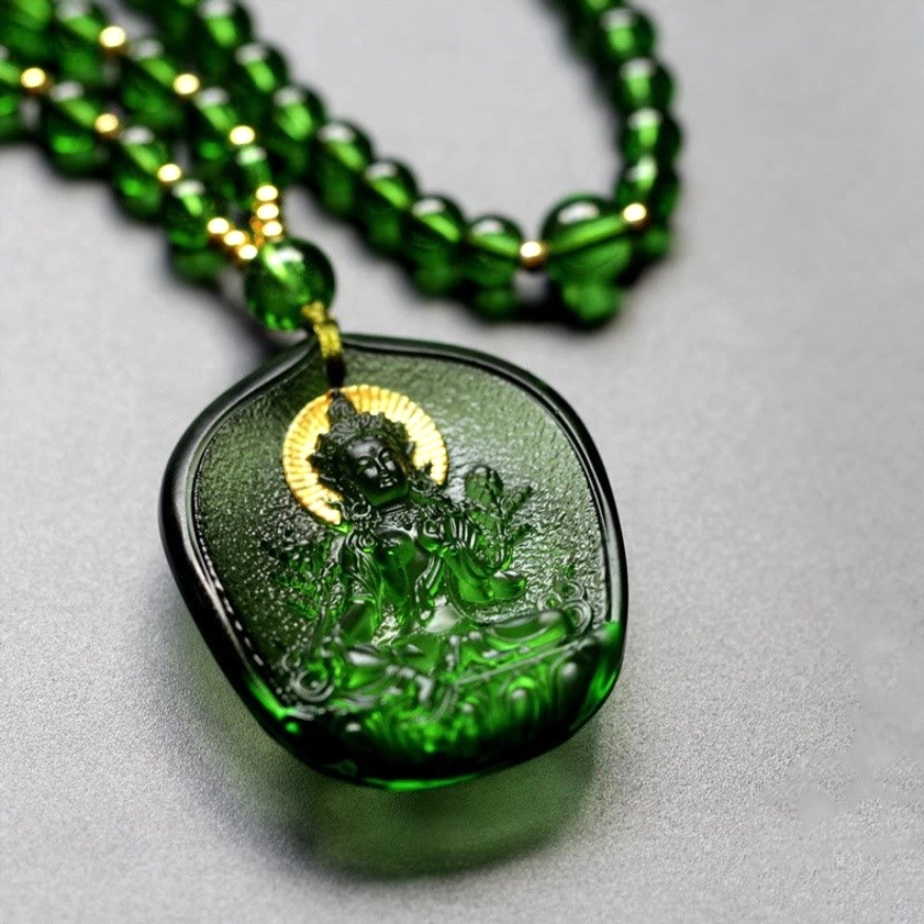 Green Tara Buddha liuli crystal pendant necklace side angle showing gold halo detail and beaded green chain