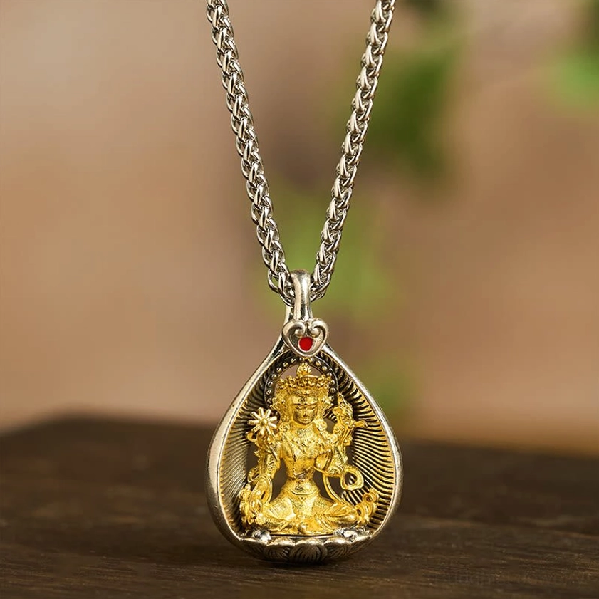 Green Tara Buddhist pendant necklace direct front view showing teardrop hollow design and protective symbolism