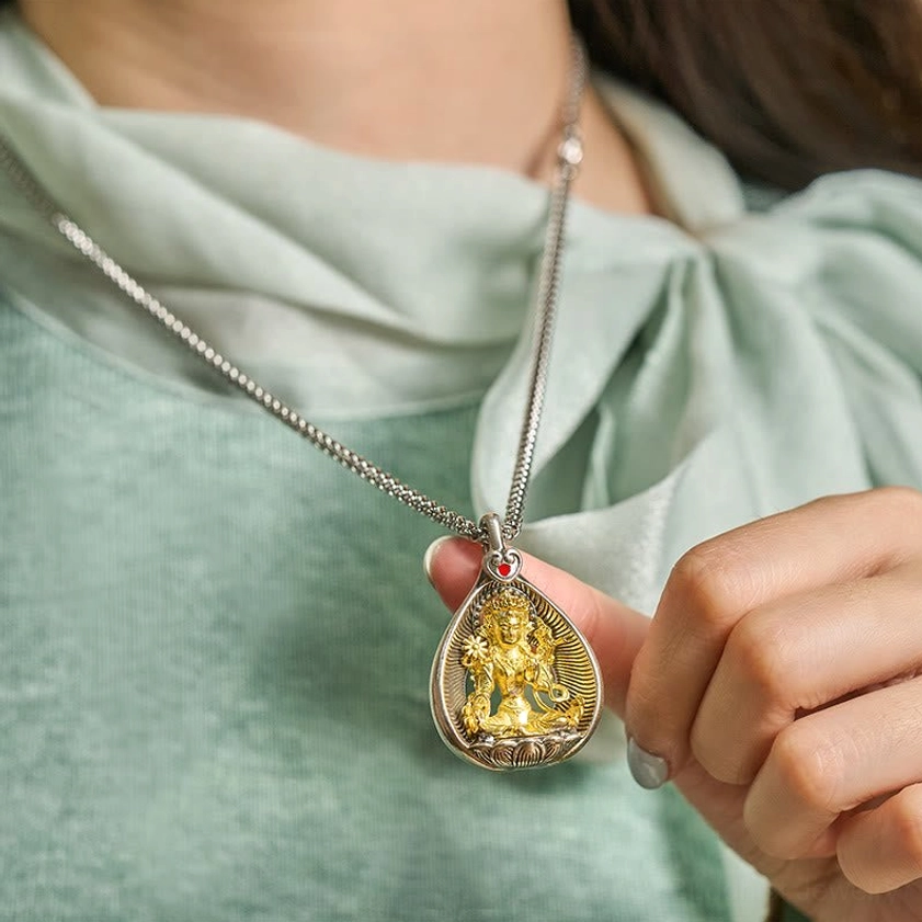 Green Tara Buddhist pendant necklace worn on person showing daily wearable size and spiritual protection energy