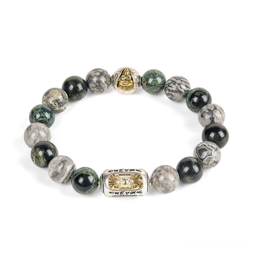 Loose grey jasper Buddhist bracelet with gold Buddha accent bead and engraved metal charm on white background