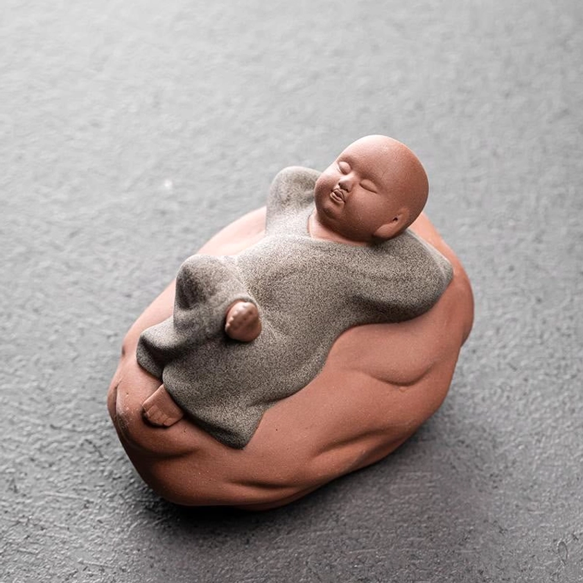 Grey ceramic resting monk figurine 8.2cm with detailed facial features and meditation expression