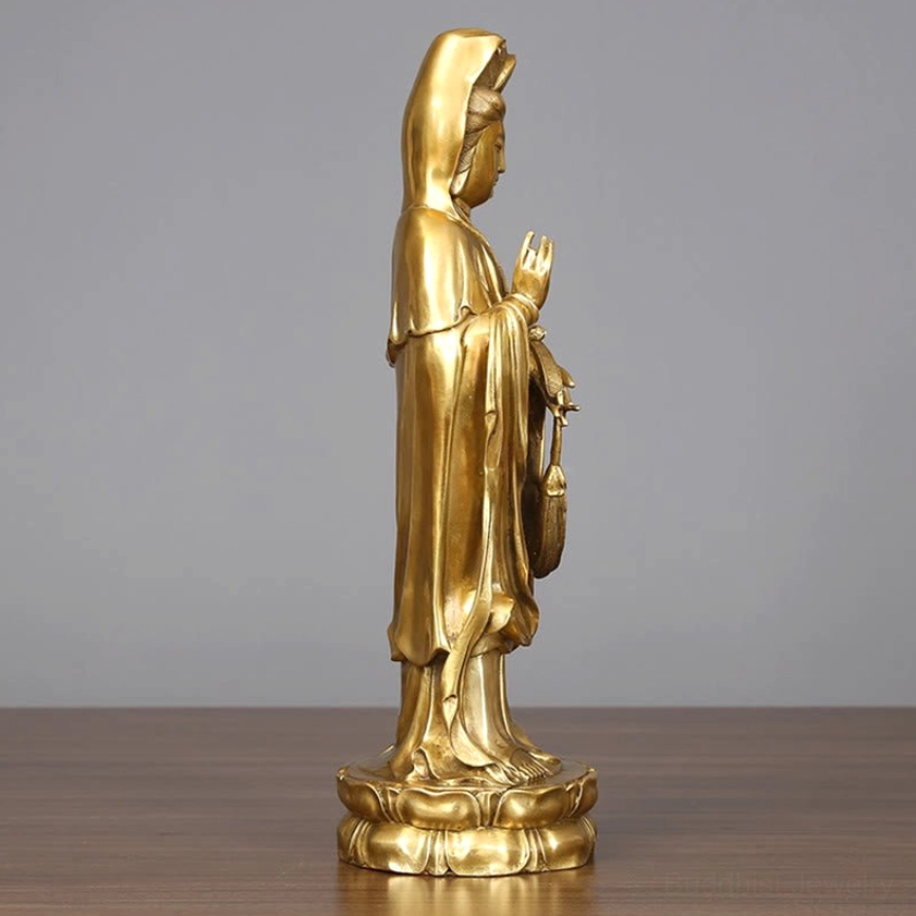 Avalokitesvara left profile view, polished golden brass deity statue in prayer mudra pose with lotus foundation