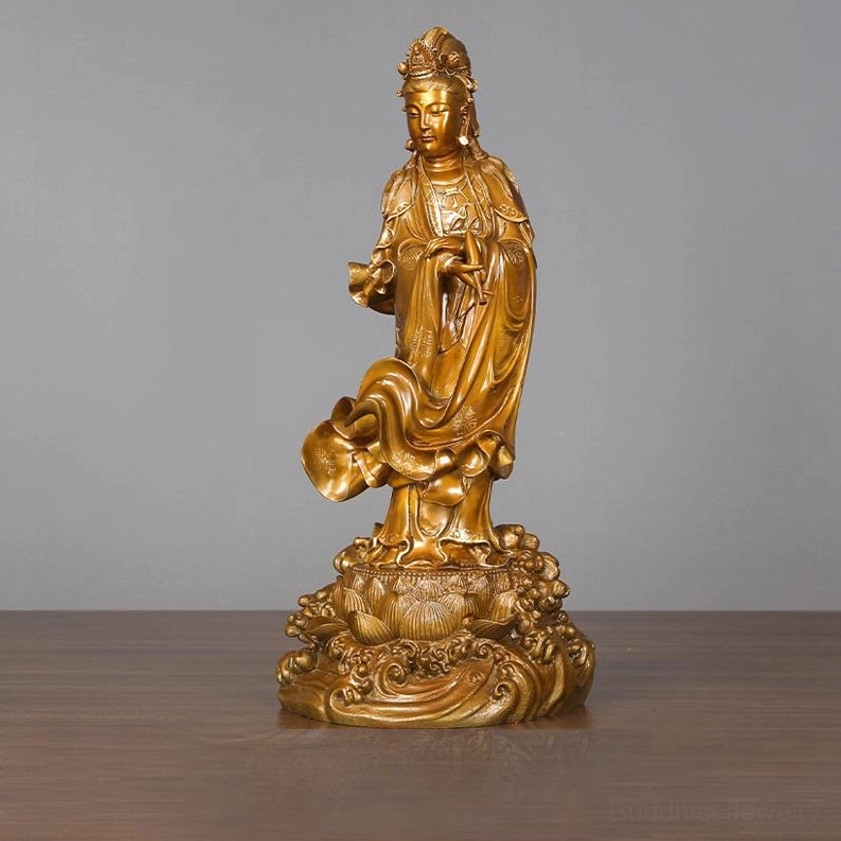 Detailed close-up of Guan Yin statue showing intricate facial features and serene compassionate expression of the bodhisattva