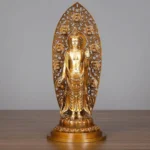 Avalokitesvara Guanyin brass statue front view - hand-carved bodhisattva with intricate flame backplate and lotus pedestal