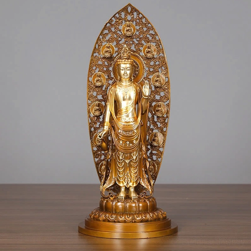 Avalokitesvara Guanyin brass statue front view - hand-carved bodhisattva with intricate flame backplate and lotus pedestal