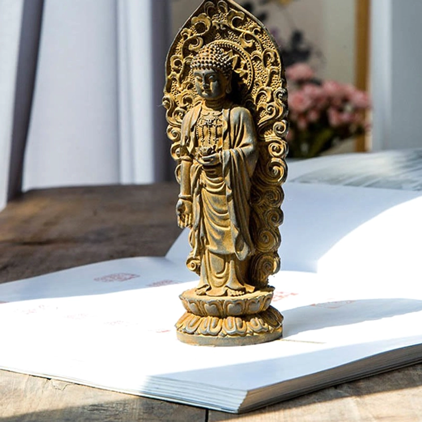 Full-length view Guanyin bodhisattva Buddha statue with spiritual symbolism and compassion iconography on wooden surface for meditation room display